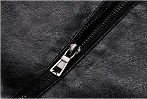 Detail shot of smooth black faux leather jacket with high-quality silver metal zipper