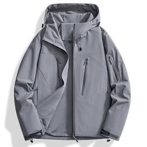Detailed view of men's grey outdoor jacket featuring windproof fabric and mesh lining