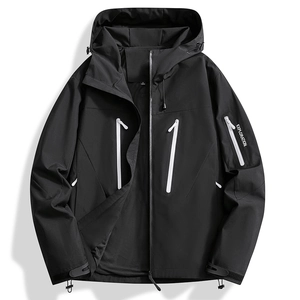 Detail of waterproof white zippers and mesh lining on a black outdoor hiking jacket