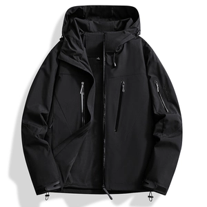 Detail of waterproof zippers and breathable mesh lining on a black outdoor jacket