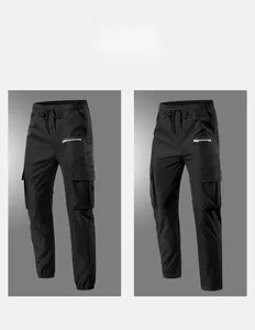 Detail view of men's black cargo pants featuring both cuffed and straight-leg styles