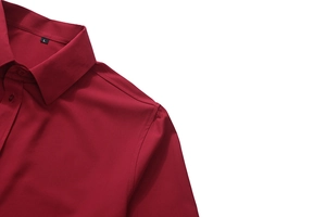 Close-up of dark red long-sleeved shirt collar and buttons with size label detail