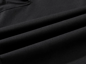 Close-up of black breathable woven fabric texture for mens athletic workout pants