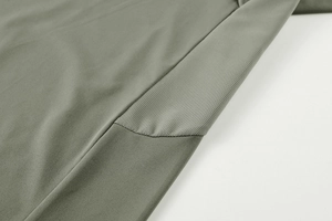 Detail view of breathable honeycomb mesh stitching on olive green sports t-shirt