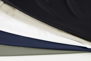 Texture detail of breathable mesh fabric showing multiple colors for men's sports t-shirts