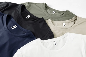 Close-up of assorted breathable quick-dry sports t-shirts with mesh texture and crew neck