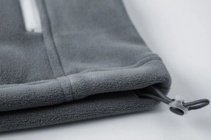 Detail of fleece jacket hem with adjustable elastic drawstring and cord lock