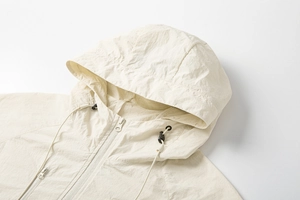 Detailed view of the nylon sun protection jacket hood with adjustable drawstring and zipper