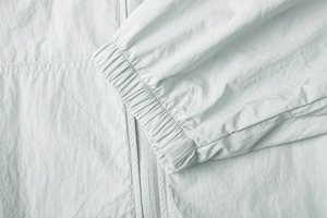 Detailed macro view of elastic cuffs and precision stitching on sun protection jacket