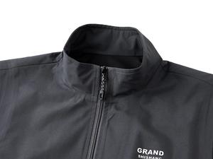 Detail of windproof stand collar vest with mesh lining and white branding print