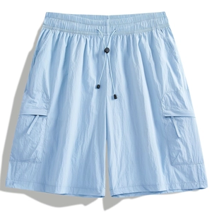 Men's light blue quick-dry cargo shorts with drawstring waist and functional flap pockets