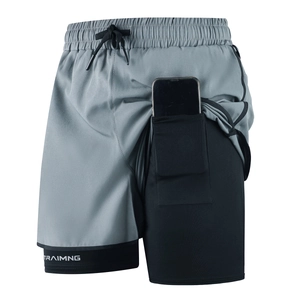 Detail of gray two-in-one sports shorts with built-in phone pocket on black inner liner