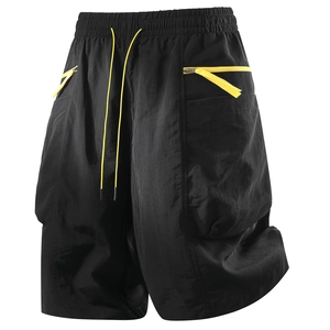 Black cargo shorts with yellow drawstrings and zip accents on a clean white background