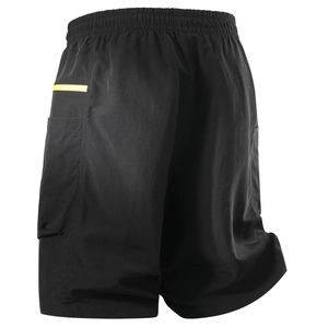 Detail of black quick-dry shorts featuring an elastic waist and cargo pocket with yellow trim