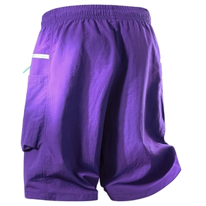 Detail of purple cargo shorts featuring textured quick-dry fabric and elastic waistband