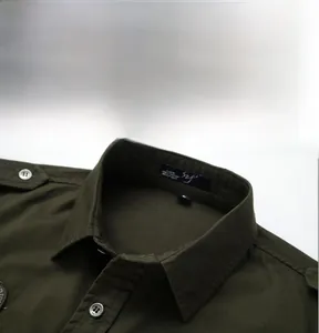 Detail view of military green cotton shirt collar with epaulets and button-down style