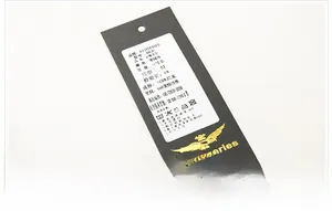Detail view of military green flight jacket tag showing 100% nylon fabric composition