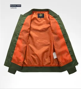 Detail view of military green bomber jacket featuring orange lining and ribbed cuffs