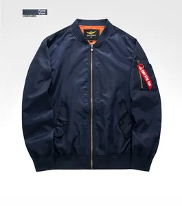 Detailed front view of navy blue MA-1 pilot jacket with classic red flight ribbon tag