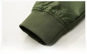 Detail of ribbed cuffs on olive green MA-1 bomber jacket with windproof fabric