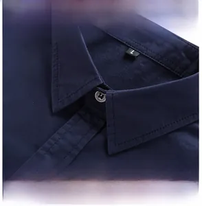 Detail of navy cotton shirt showing standard collar and MARINES engraved button