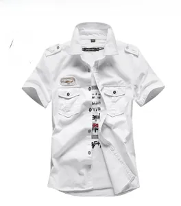 Detailed view of white military-style short sleeve cotton shirt with shoulder epaulettes