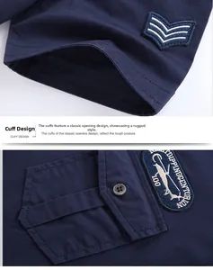 Detail of dark blue military cotton shirt featuring aviation badges and sleeve embroidery