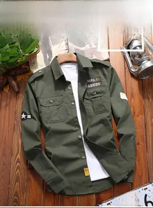 Detail of army green military style shirt featuring chest pockets and star patches on the sleeve