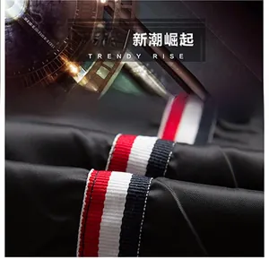 Detail of black jacket sleeve with red, white and blue striped ribbon trim decoration