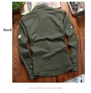 Detailed back view of military green cotton cargo shirt with embroidered arm patches