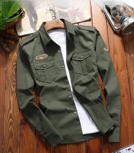 Detail view of army green tactical cargo shirt with chest pockets and military patches