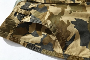 Detail of reinforced seams and classic camo pattern on cotton cargo shorts waistband