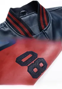 Detail of vintage baseball collar leather jacket with 08 embroidery and striped cuffs