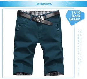 Detail of ink green slim fit casual shorts showing checkered inner lining and button accents