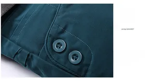 Close-up of side pockets with two buttons on men's dark green slim fit casual shorts