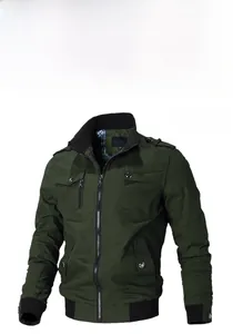 Detail of military green jacket showing stand collar, rib knit cuffs and plaid lining