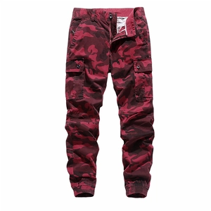 Detail of red and black camouflage cargo pants with large side pockets and elastic cuffs