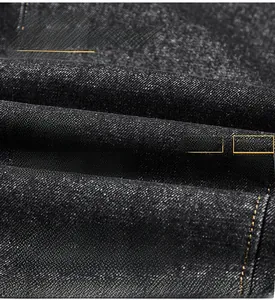 Macro texture du tissu denim gris foncé avec tissage infroissable et anti-boulochage