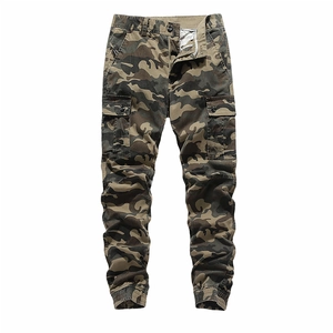 Detail view of camouflage cargo pants featuring large flap side pockets and elastic joggers cuff