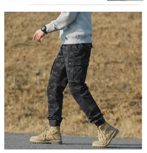 Detail of cargo pants showing camouflage pattern with large side flap pockets