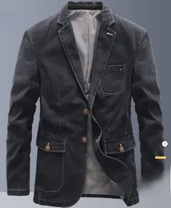 Detail of slim fit denim blazer showing three-button closure and bird pattern lining