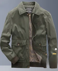 Close-up of military green jacket with star embroidery and vintage patterned lining