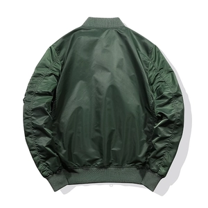Rear view of dark green bomber jacket showing satin finish and ruched sleeve details