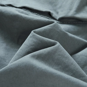 Macro shot of high-quality cotton twill fabric showing detailed weave and soft texture