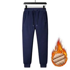 Detail of navy men's fleece-lined joggers showing warm interior and elastic waistband