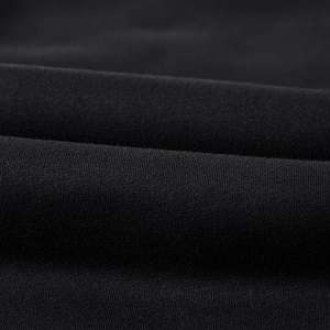 Close-up of thick black thermal fabric texture showing dense weave and soft finish
