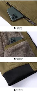 Detail of khaki jacket showing zip pockets, fleece lining and ribbed elastic hemline