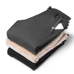 Detail of warm sherpa lining and deep side pockets on men's winter joggers