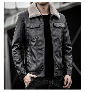 Close-up of black PU leather jacket featuring faux shearling collar and metal chest pockets