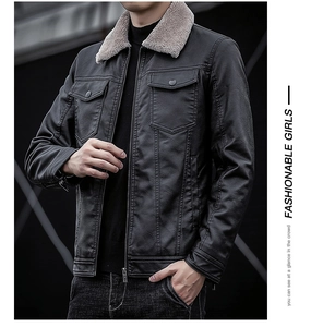 Detail of men's black leather jacket with grey faux fur collar and large flap pockets